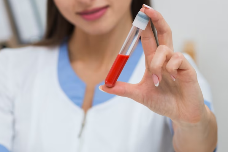 Practitioner holding a blood sample tube